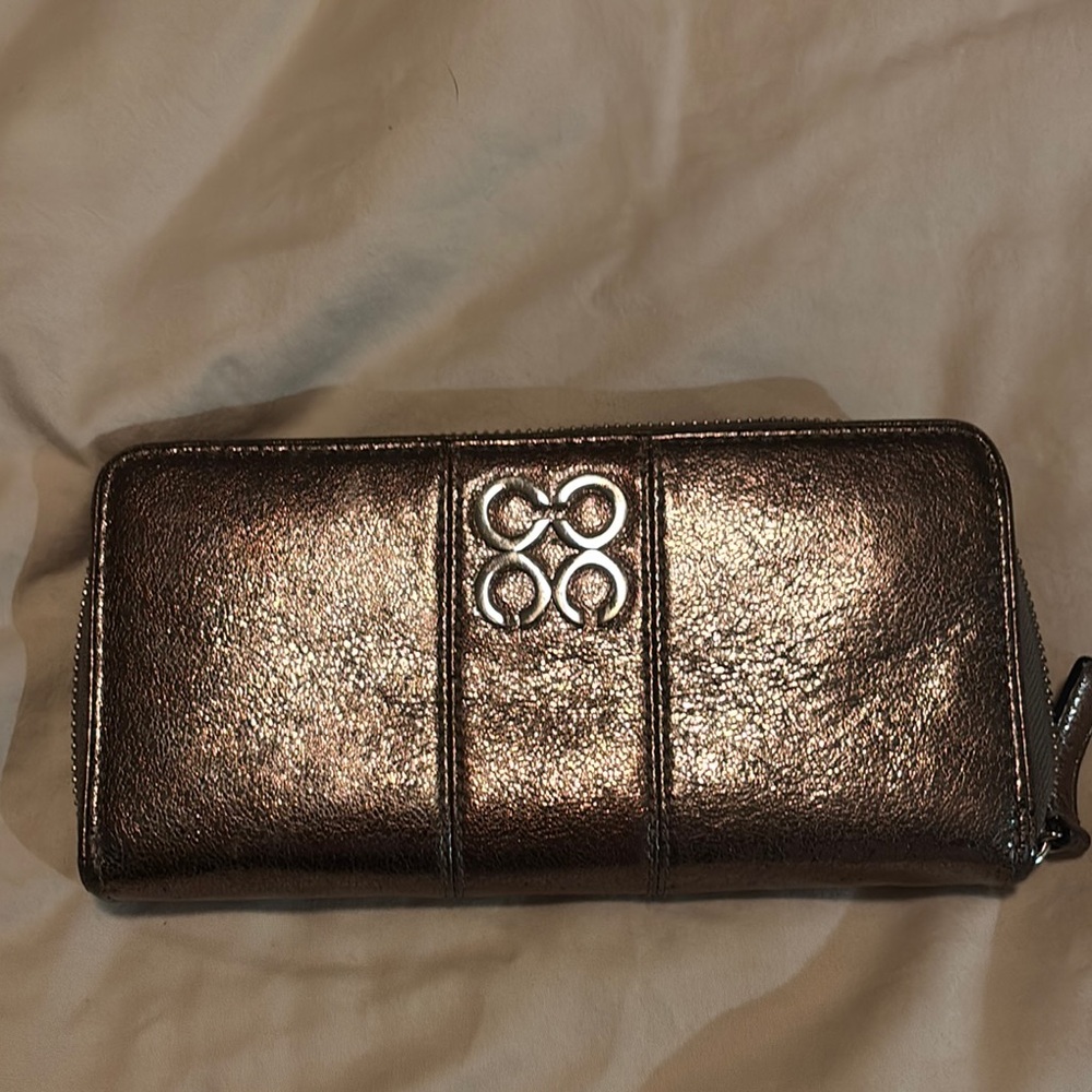 Coach Metallic leather wallet. Zipper closure.